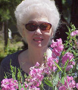 My still lovely Tita Pat when she came to visit us. Mccloud, CA 2000 with wild flowers.