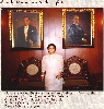 Aurora L. Pastor w/ portraits of Pres. Quezon and President Jose Laurel, her Godparents