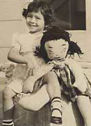 I remember this doll! Also to the left slightly in back of me, a rubber elephant whose nails I used to paint; red as I recall.